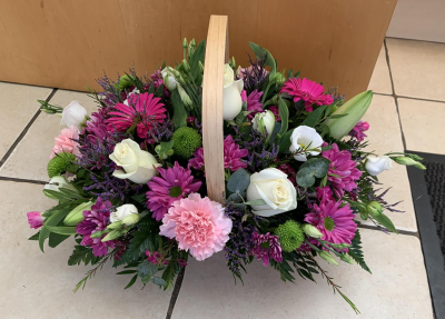 Bon Bon - Shower them with love with this cutesy collection of seasonal flowers in pretty pastels. Beautifully arranged and stylishly presented in a traditional basket.